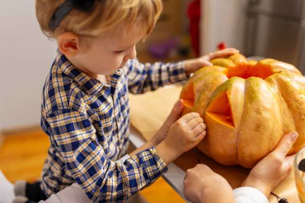 young-boy-carving-a-pumpkin